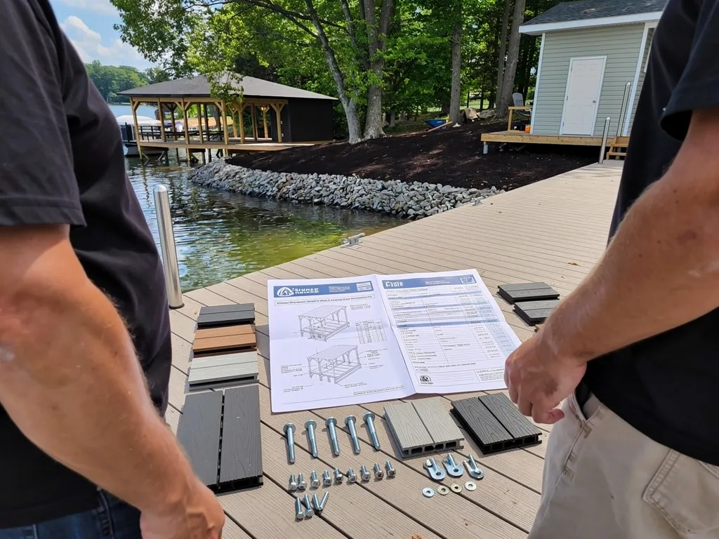 Contractor and homeowner reviewing a dock construction quote and materials list