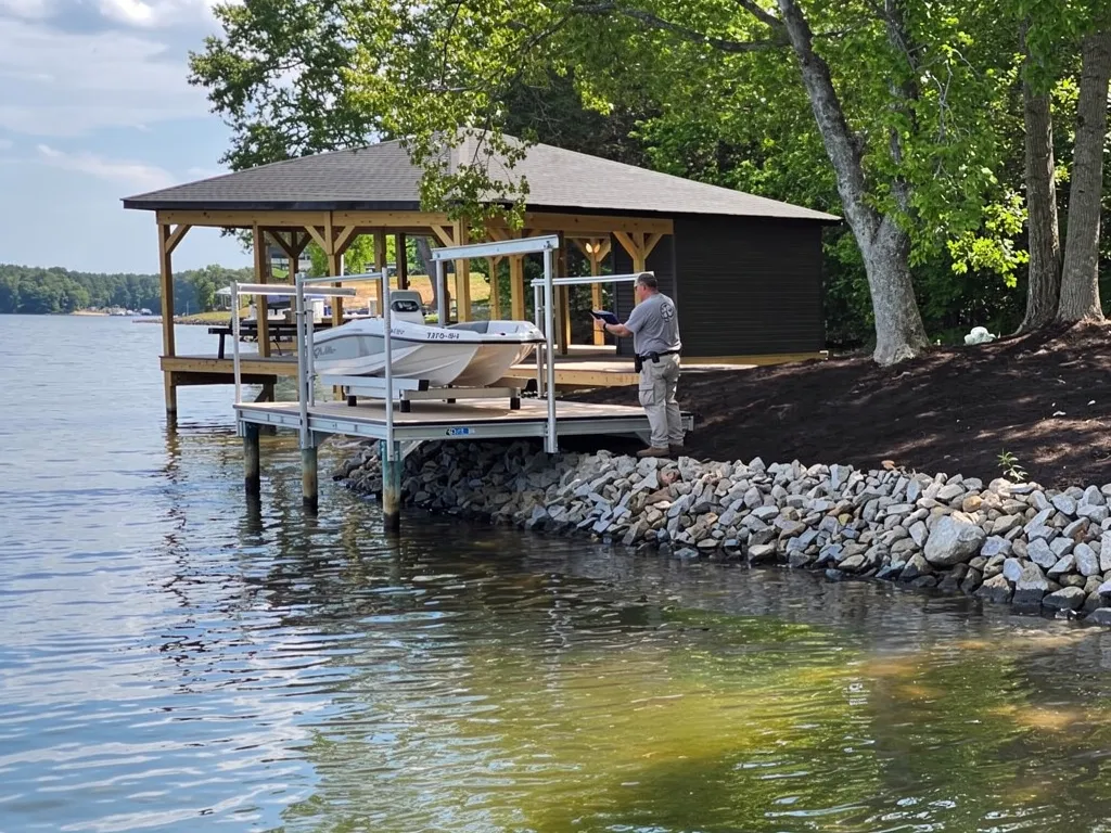 Storm-damaged boat lift and seawall being assessed at Lake Anna