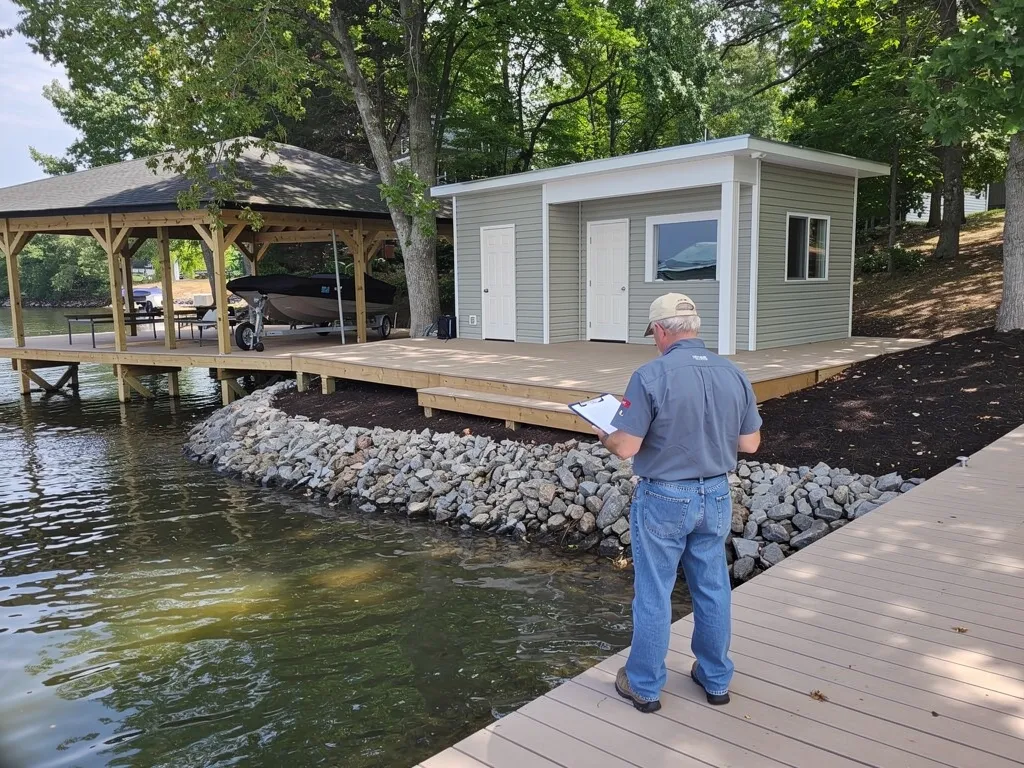 Crew repairing damaged dock decking and pilings on Lake Anna