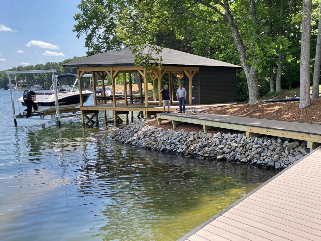 Technicians installing a boat lift on a Lake Anna waterfront dock