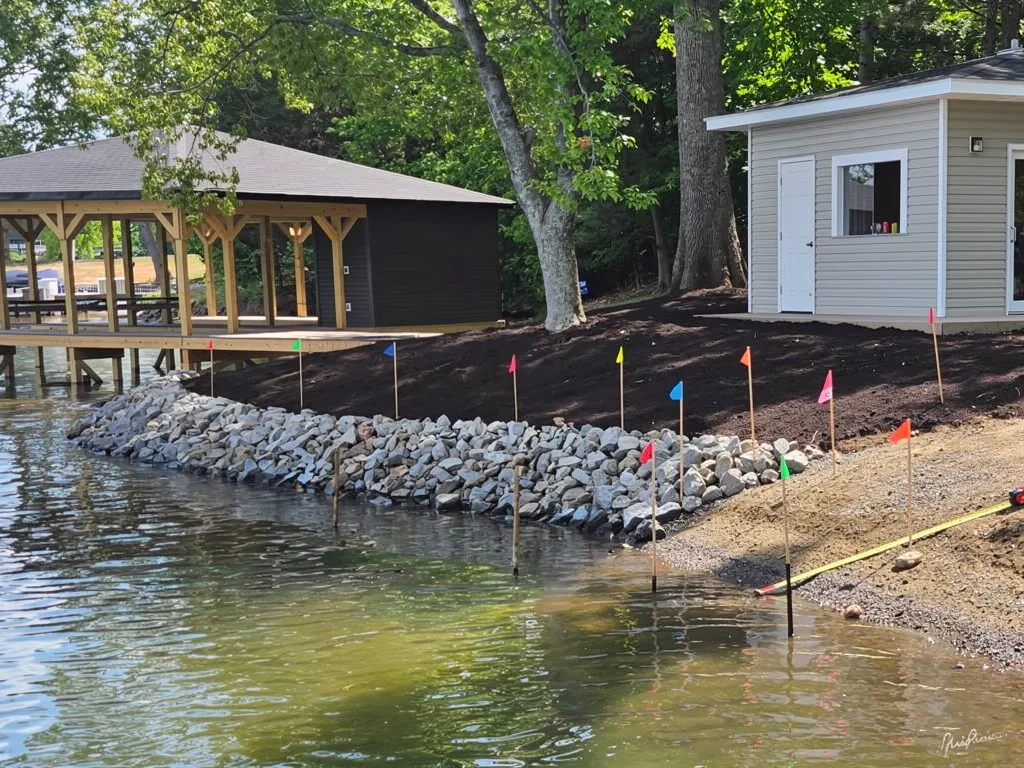 Construction crew building a seawall along a Lake Anna property