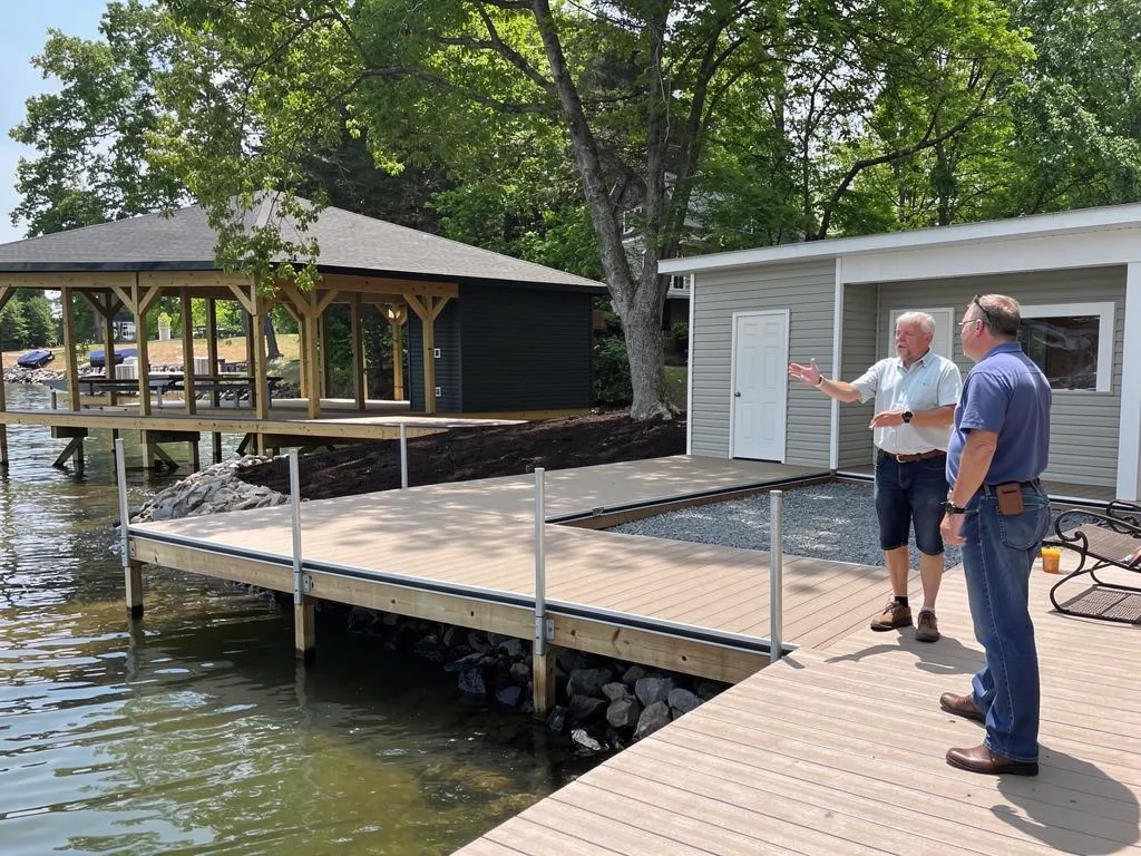 Crew constructing a custom pier over Lake Anna water
