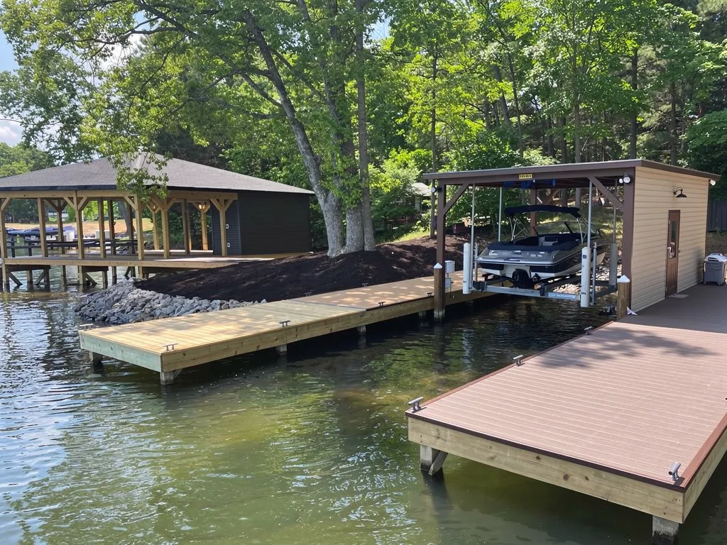 Custom dock under construction with composite decking materials and tools