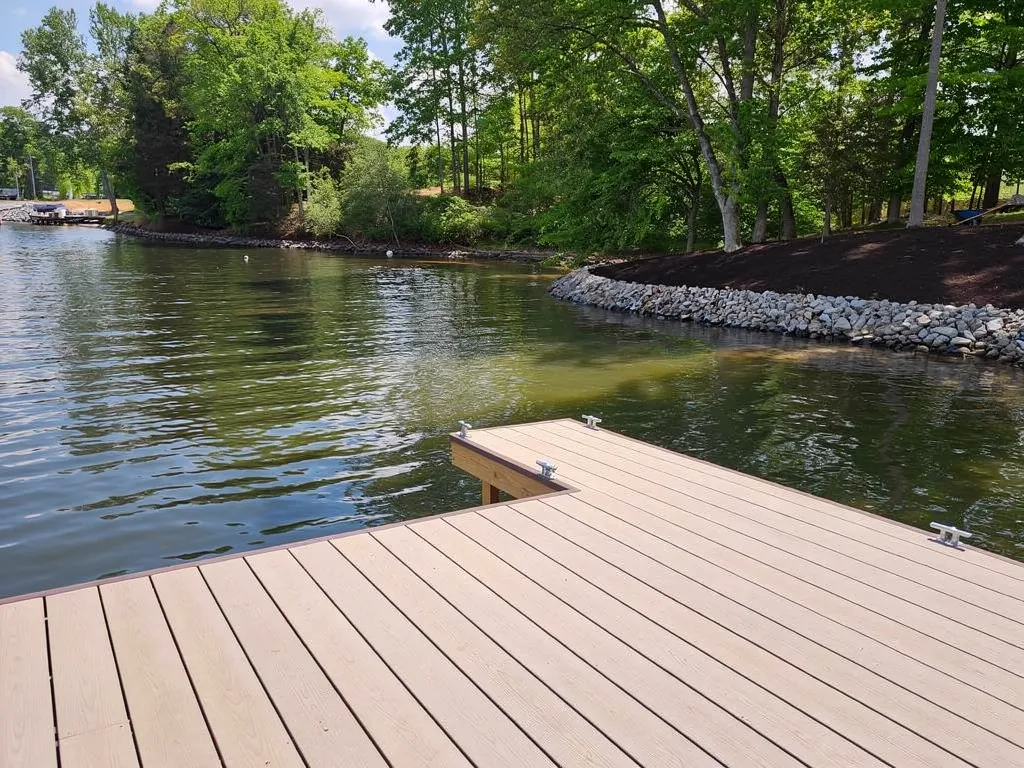Close-up of capped composite decking boards on a lake dock